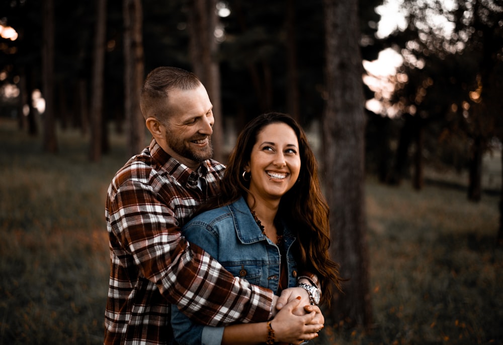 man back hugging woman photo