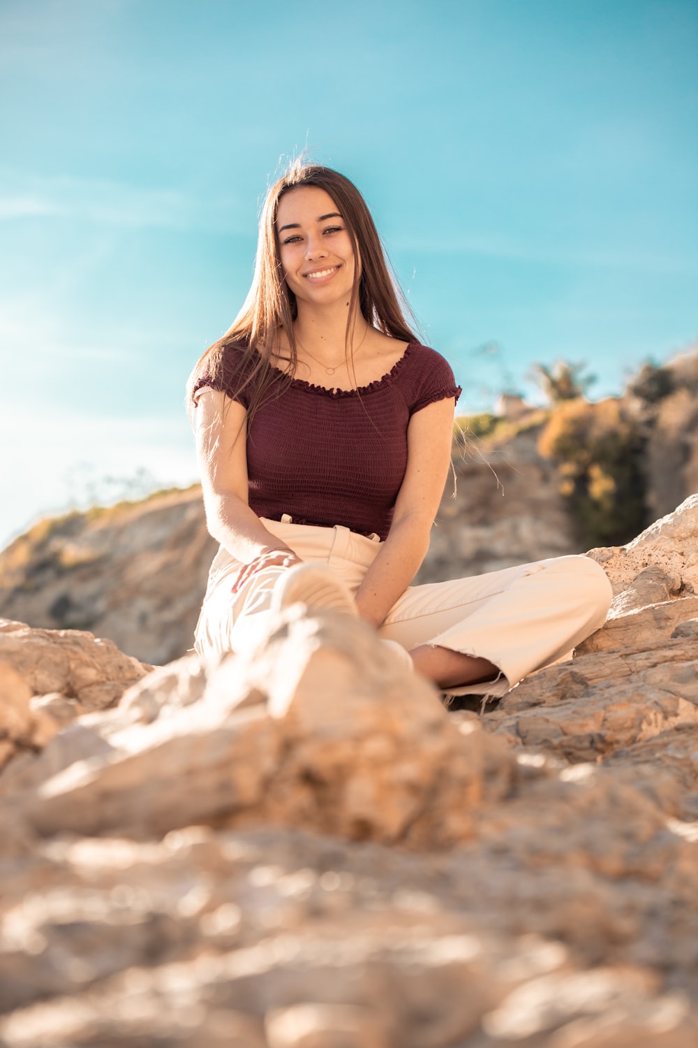 woman wearing maroon off-shoulder top