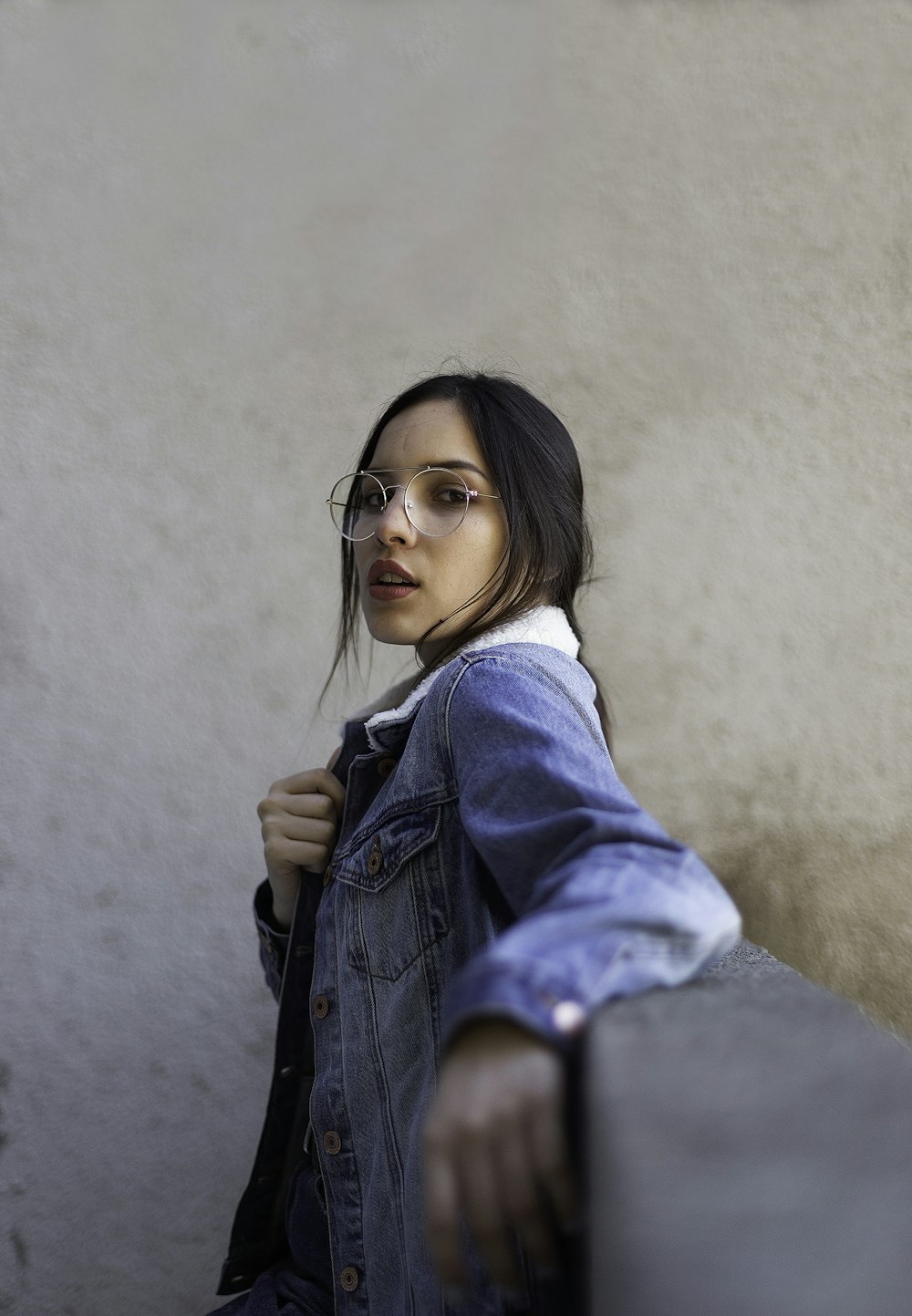 woman wearing blue denim jacket