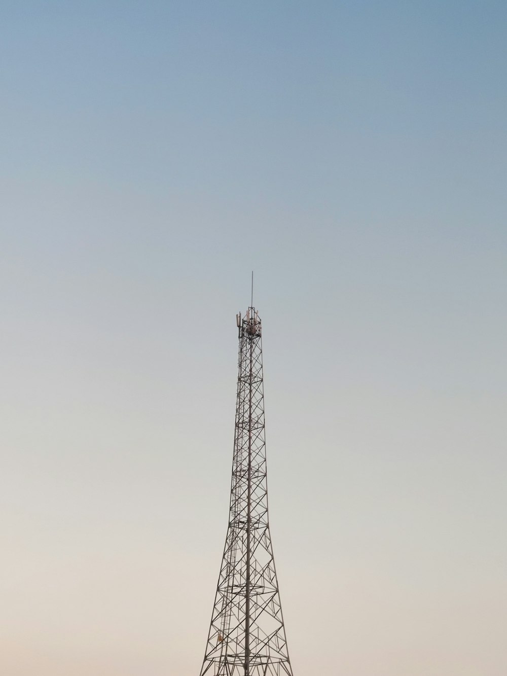 brown metal tower under blue sky