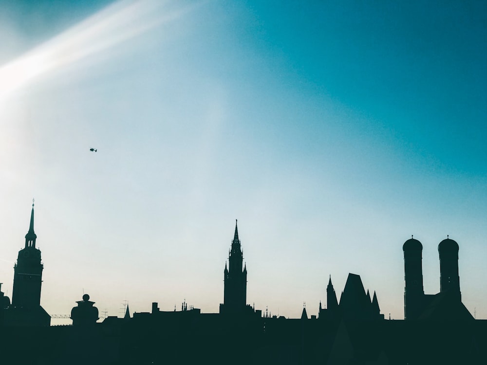 silhouette of building under blue sky