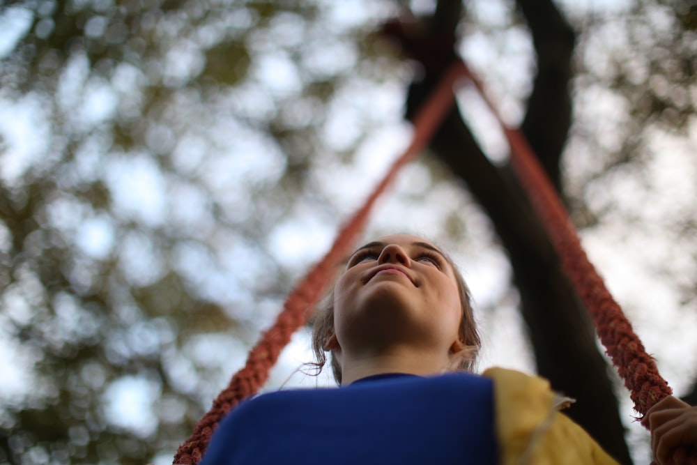 woman sitting on swing