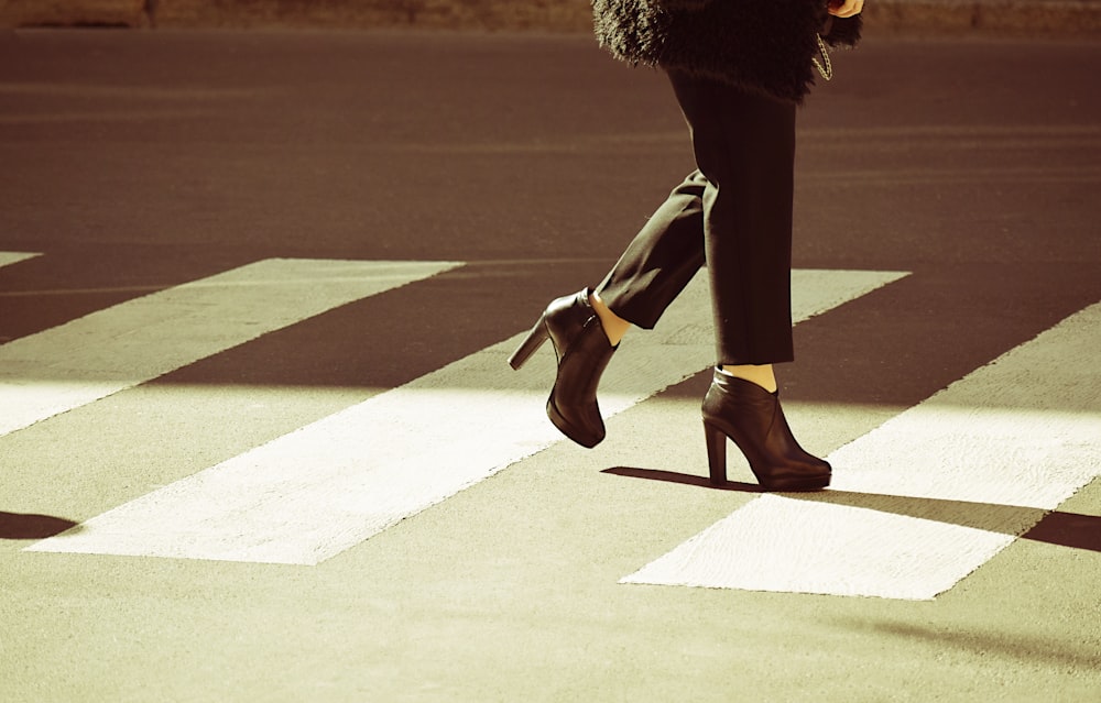 woman walking on pedestrian lane