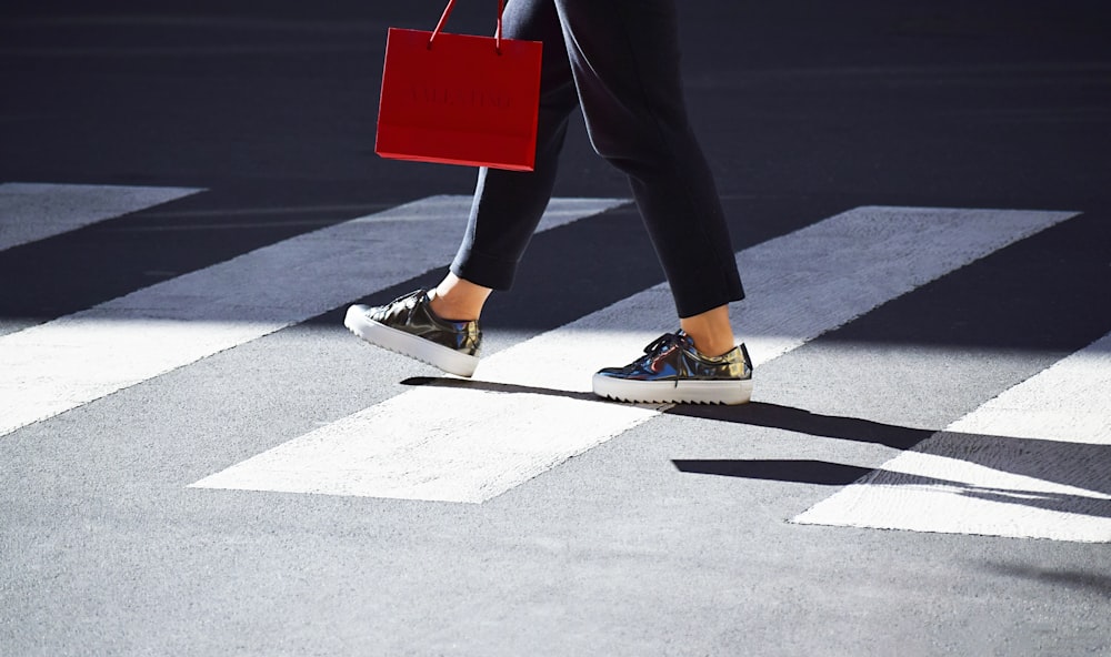 person walking on pedestrian lane