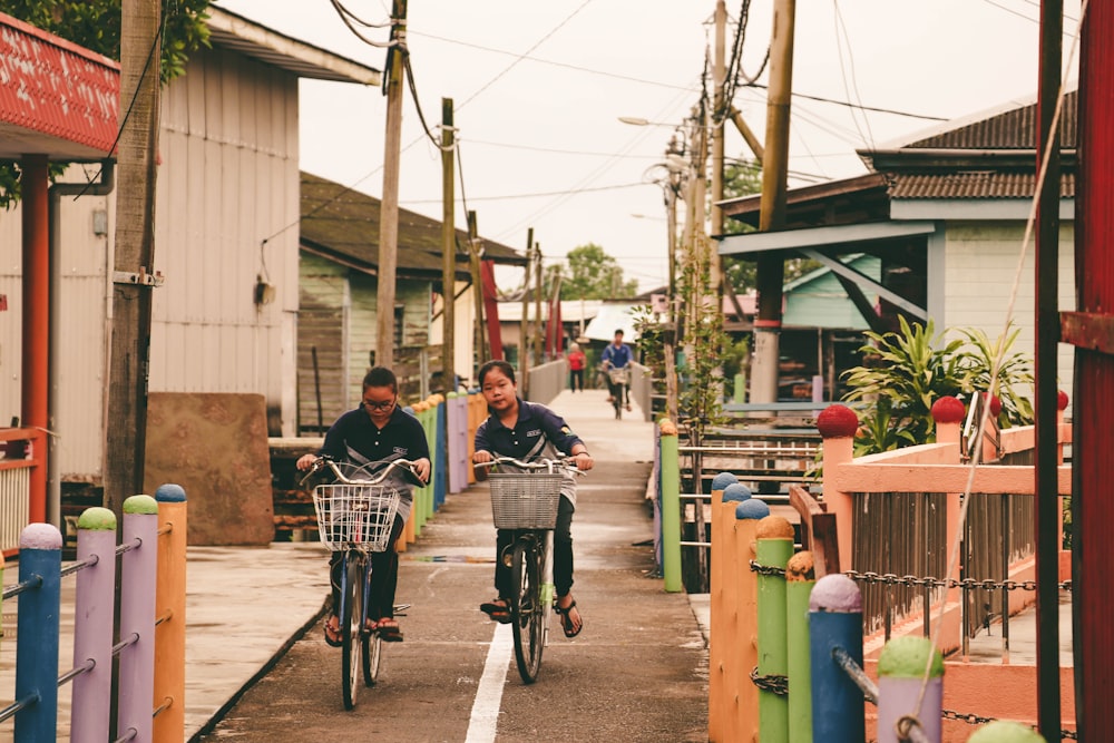 two children riding on bikes