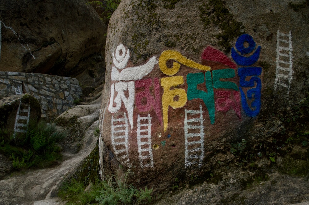 a rock with a painted sign on it