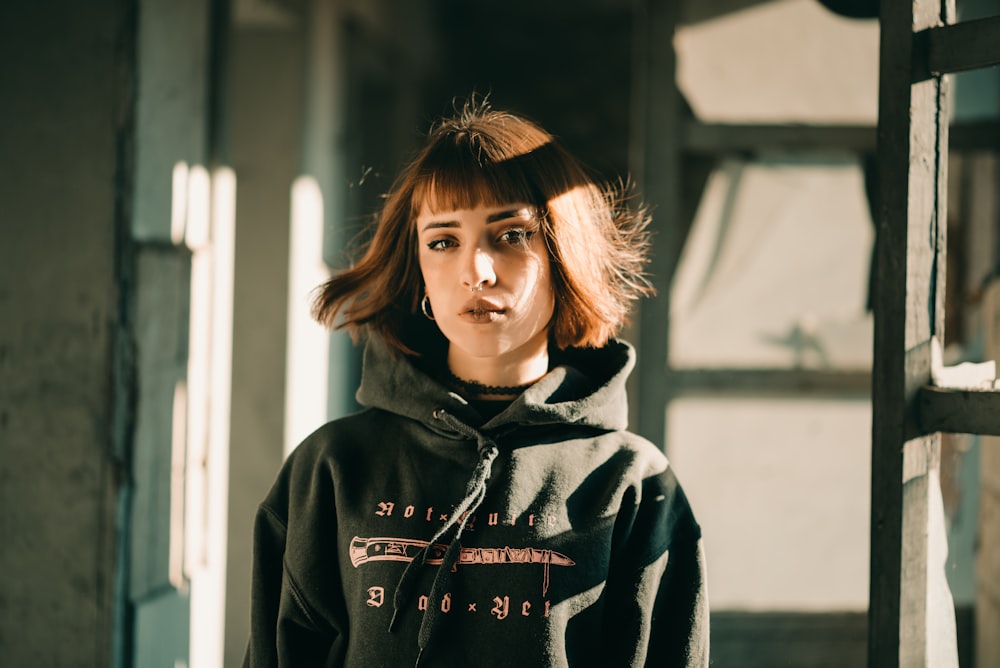 woman in green hoodie