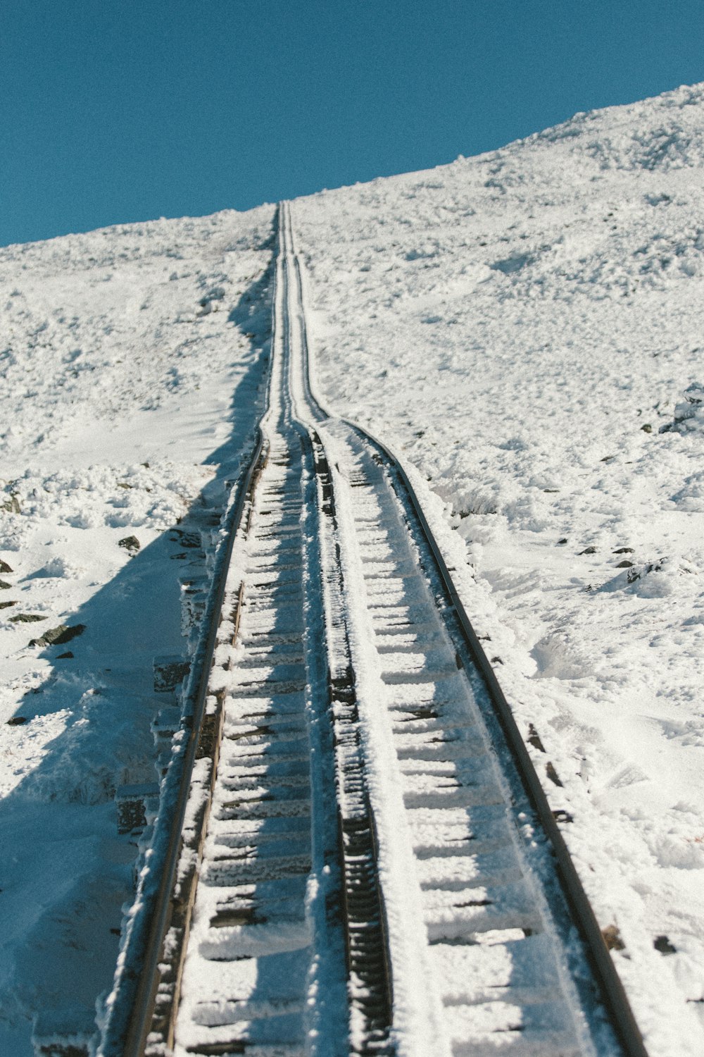black metal rail surrounded white snow