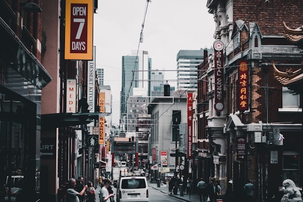 A vibrant city street in Texas showcasing small businesses buzzing with customers.