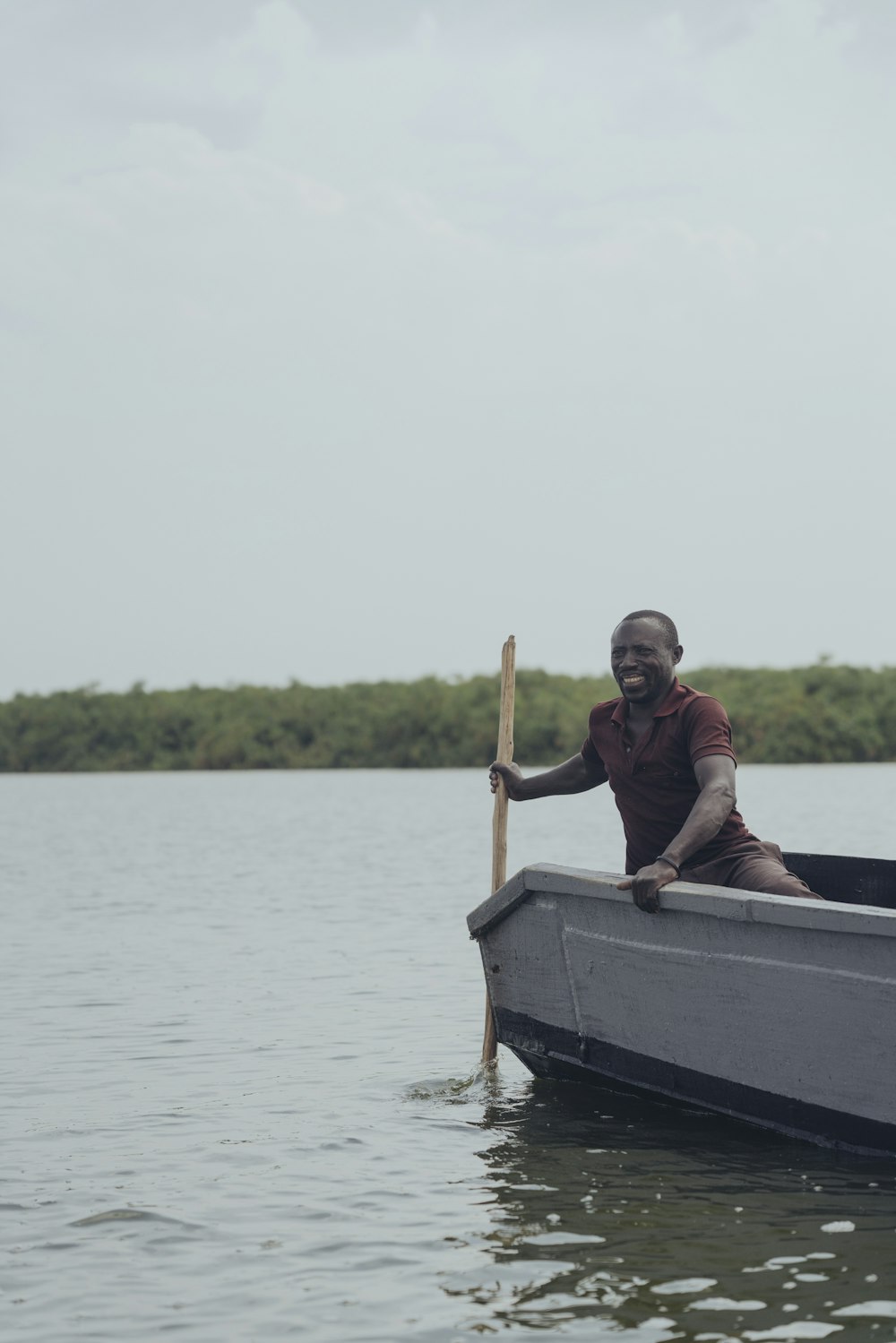 man riding boat during daytime