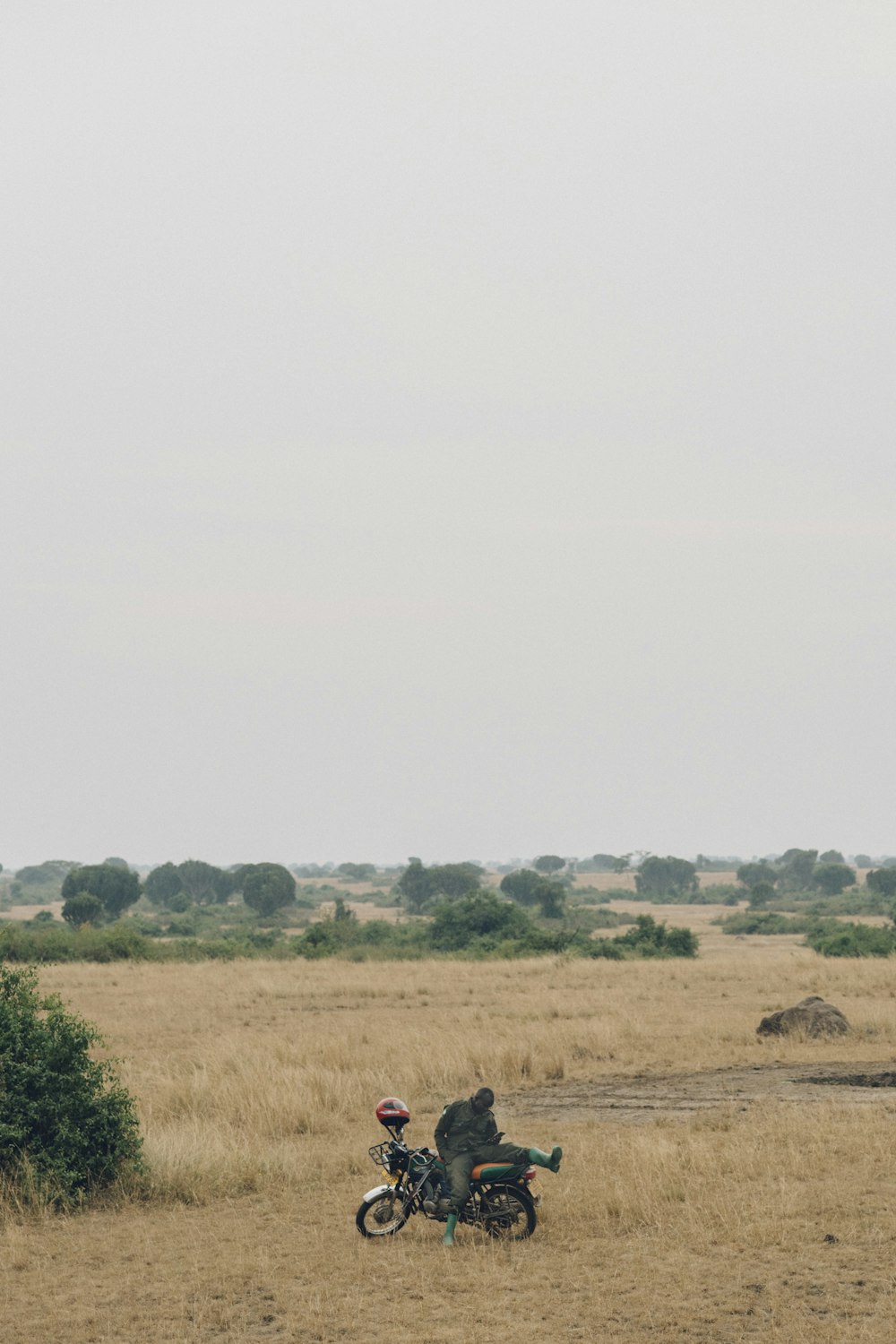 man sitting on motorcycle