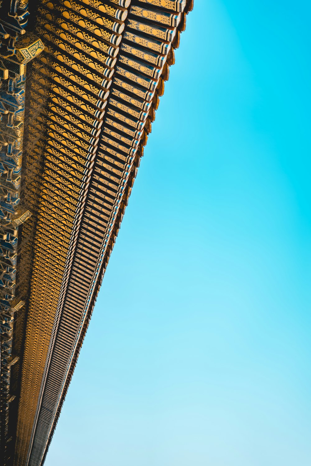 a tall building with a blue sky in the background