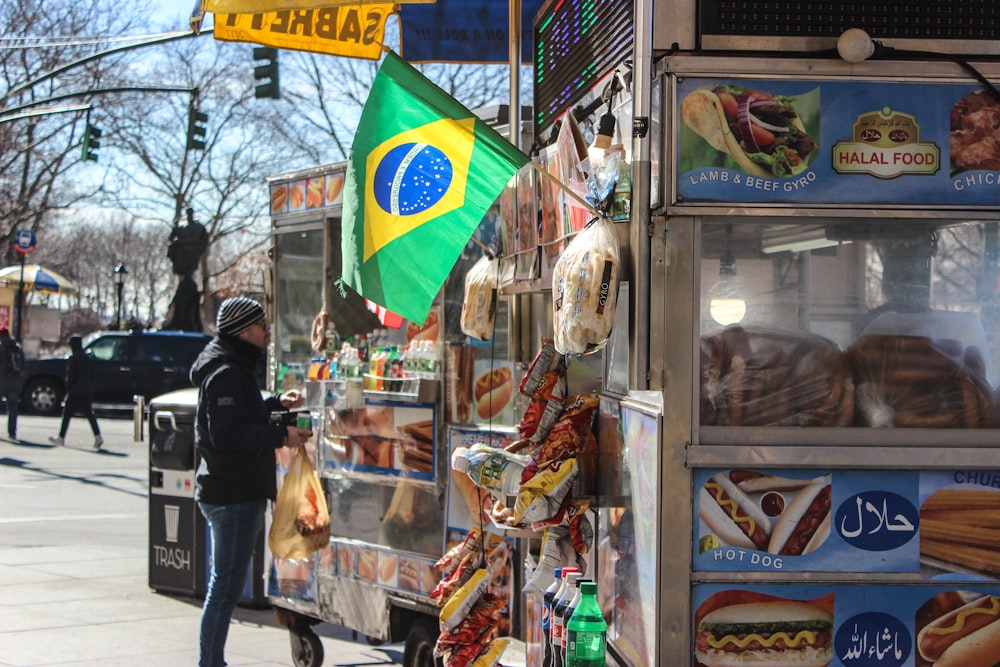 man standing on food stall