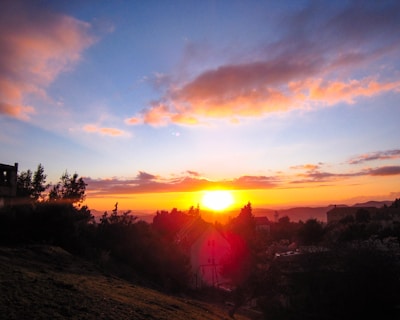 A beautiful sunset over a residential area.