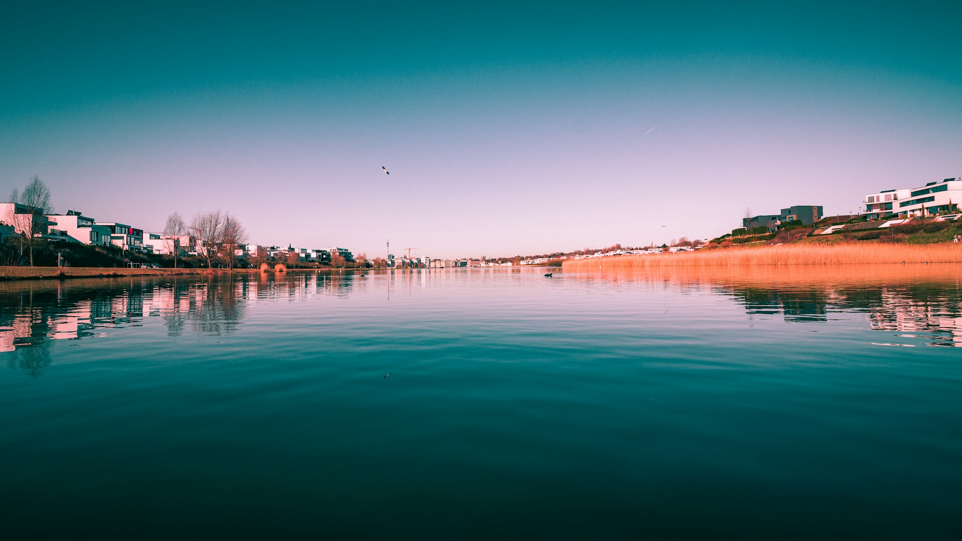 body of water under blue sky