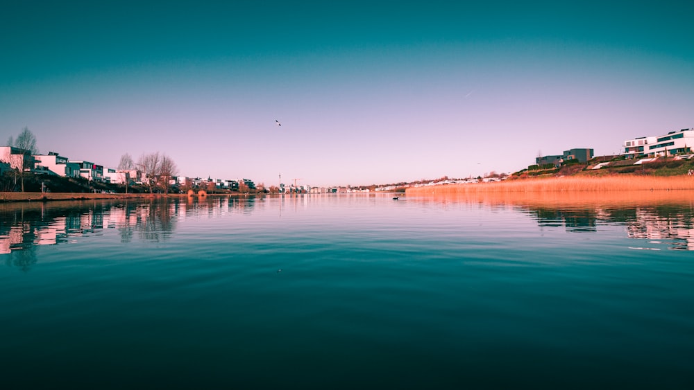 body of water under blue sky