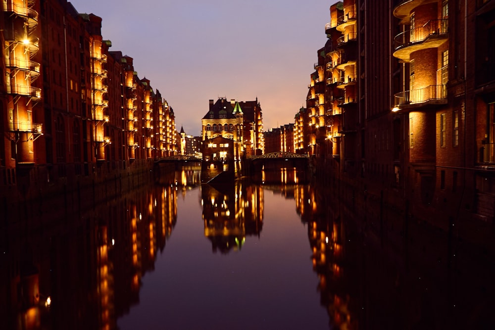 architectural photography of brown house beside body of water