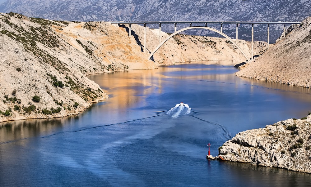 body of water between cliff