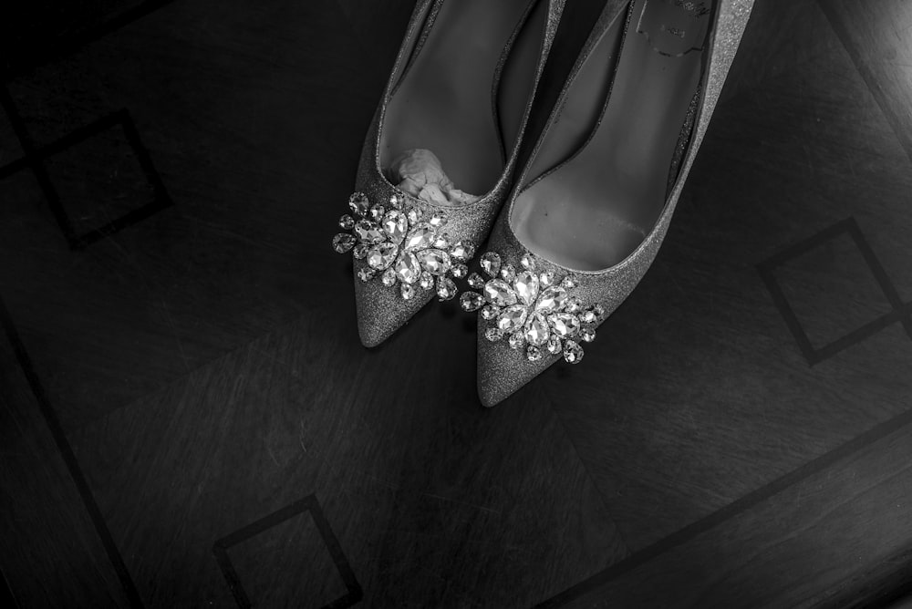 silver pointed-toe pumps