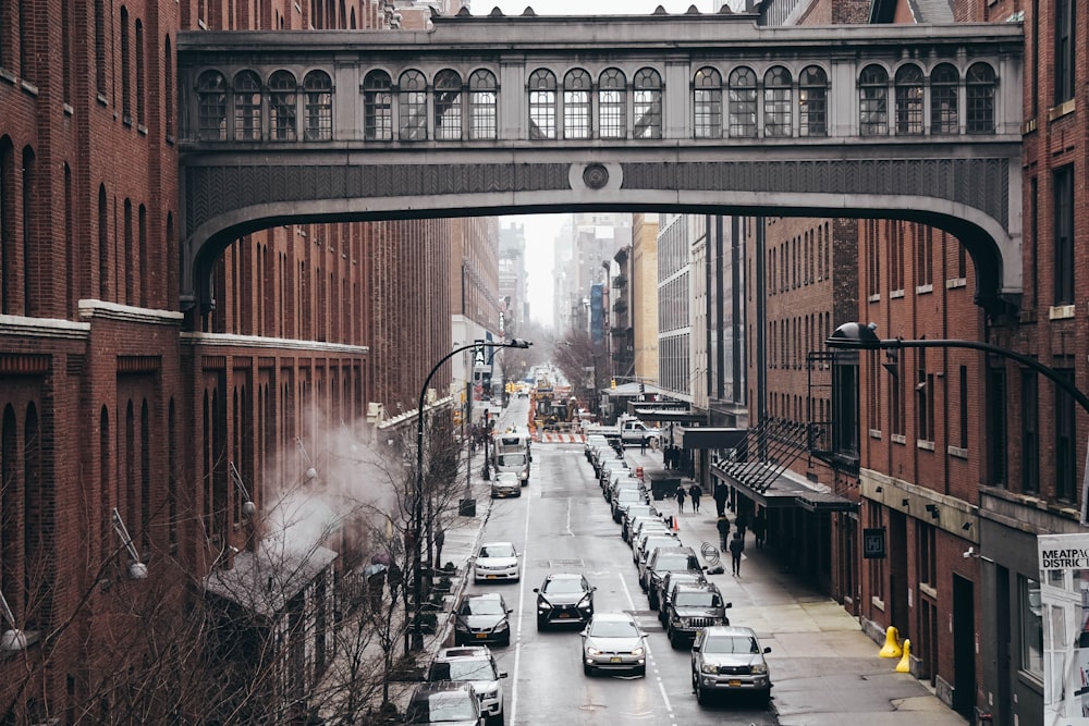 assorted vehicles between buildings