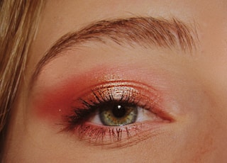 woman with pink and gold eyeshadow makeup