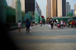 A group of diverse professionals carrying Bagg Loop bags in an urban setting.
