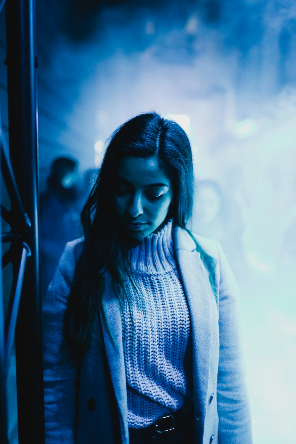 woman in knitted inner shirt inside a buildding