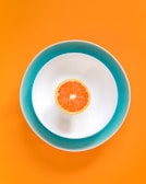 sliced orange fruit in bowl