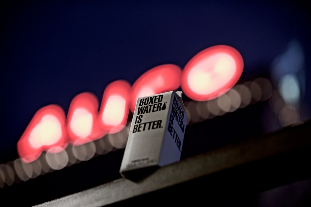 selective focus photography of boxed water box on table