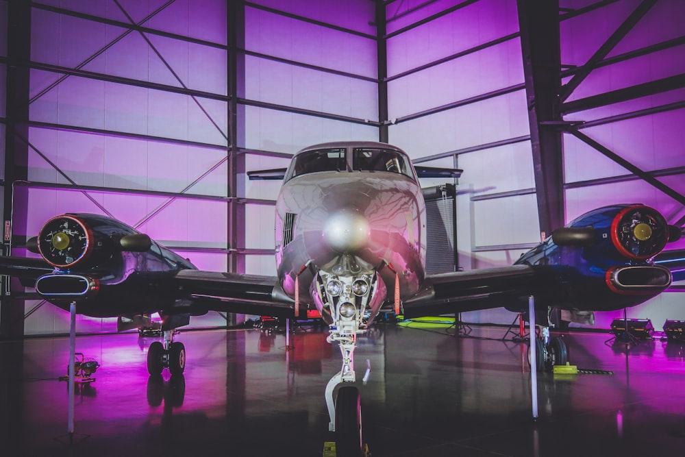 white private jet in hangar