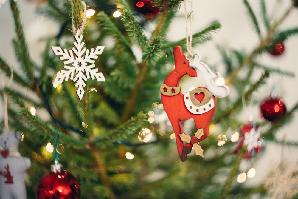 selective focus photography of red deer Christmas tree decor