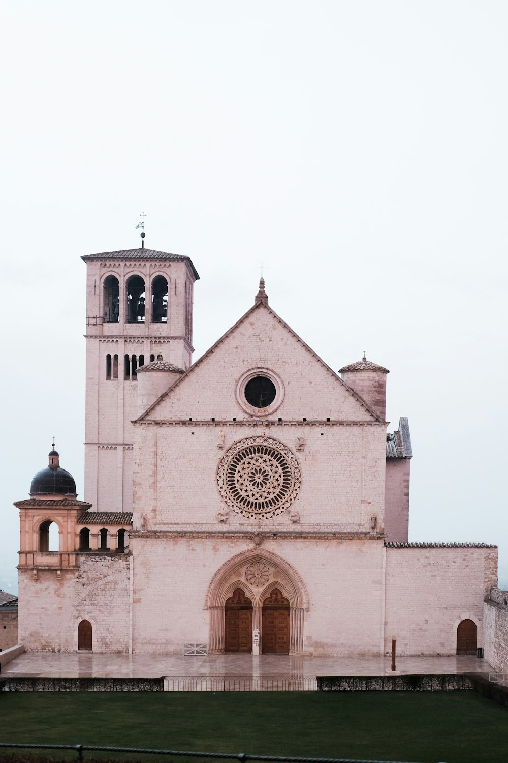 pink concrete building under white skies