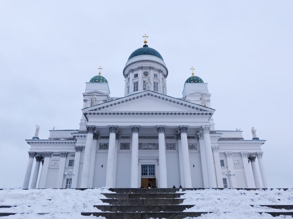 white and blue dome building with pillars during daytime