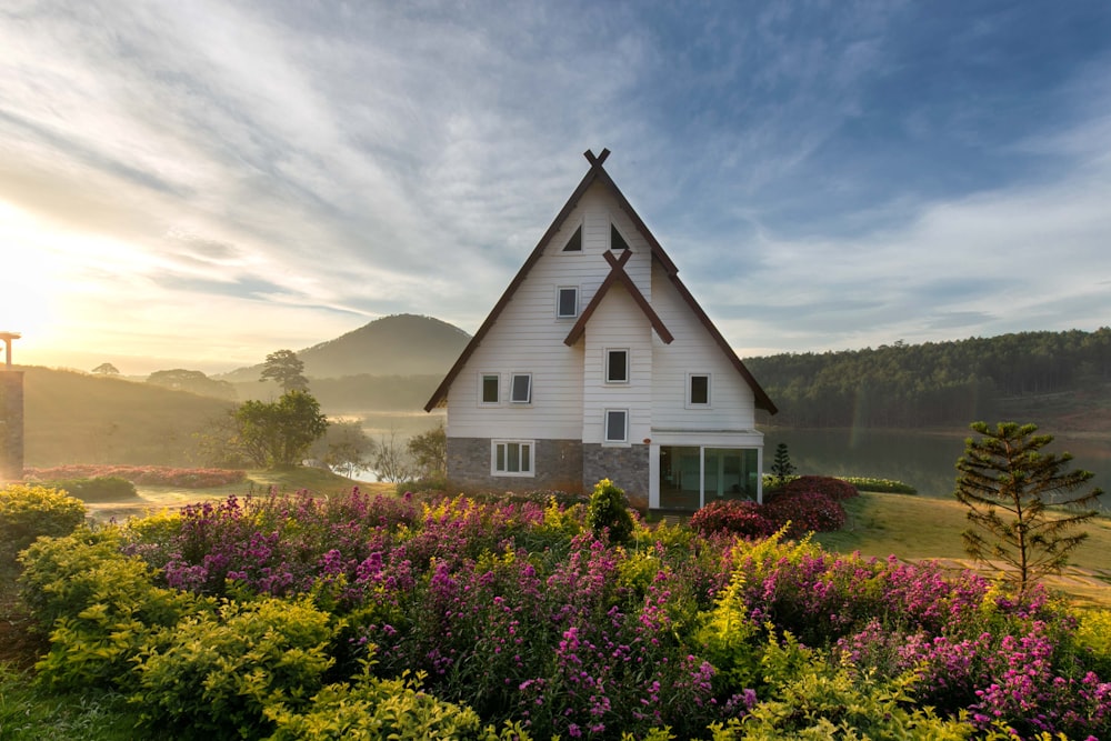 white and gray painted house with meadow of lavender