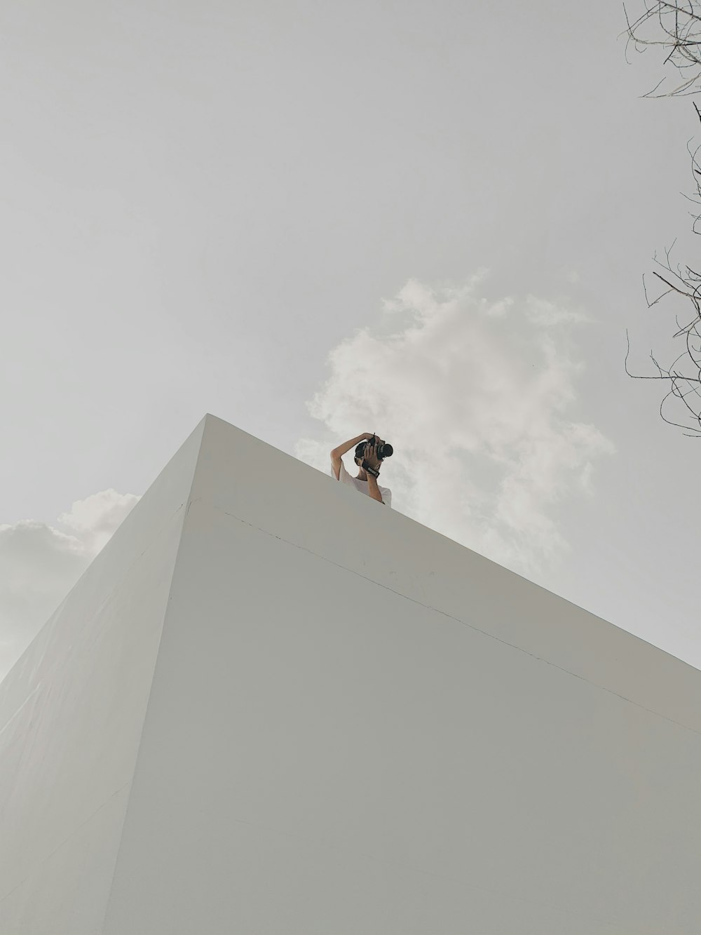 person at the roof of a building using camera