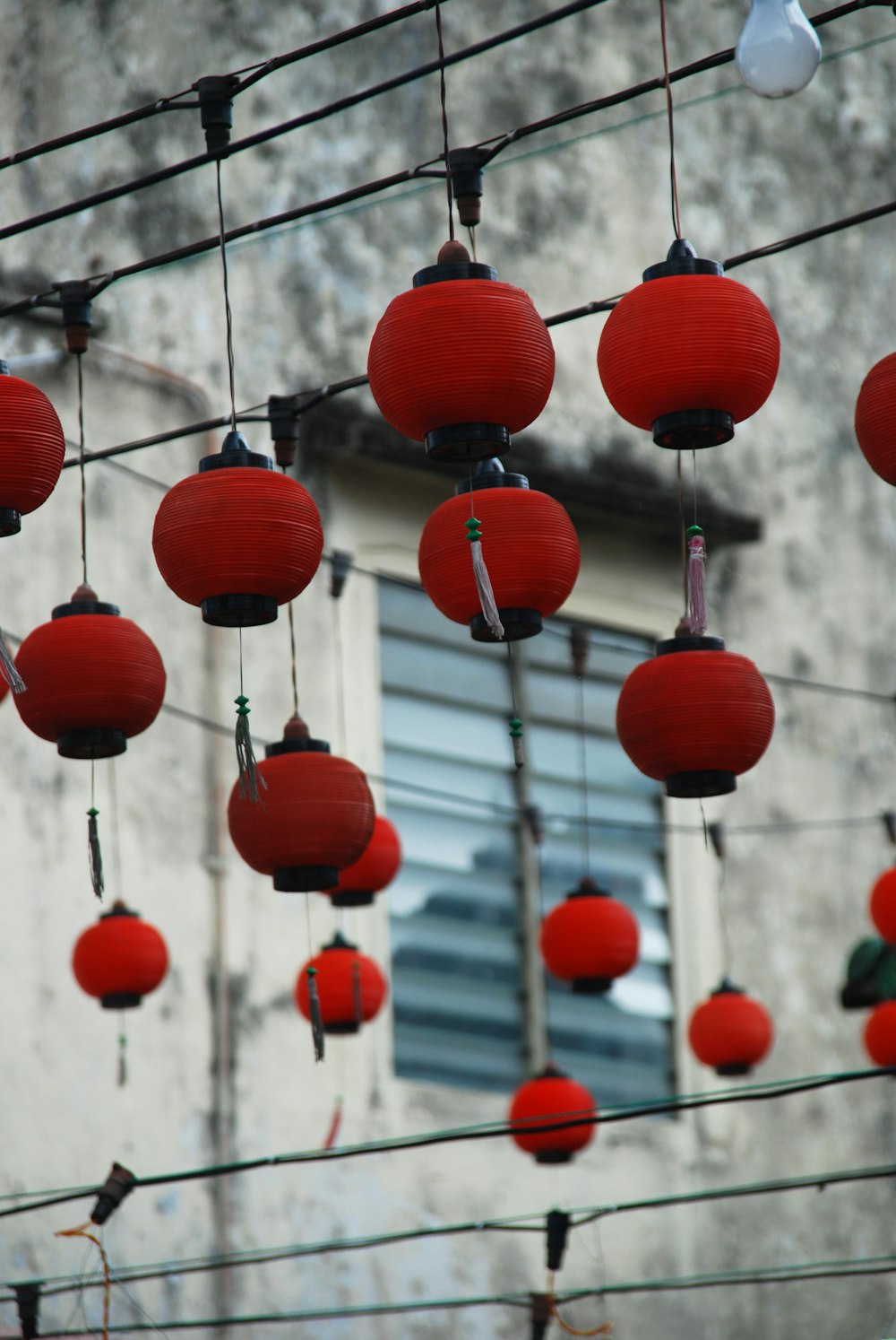 selective focus photography of red and black Japanese lanterns