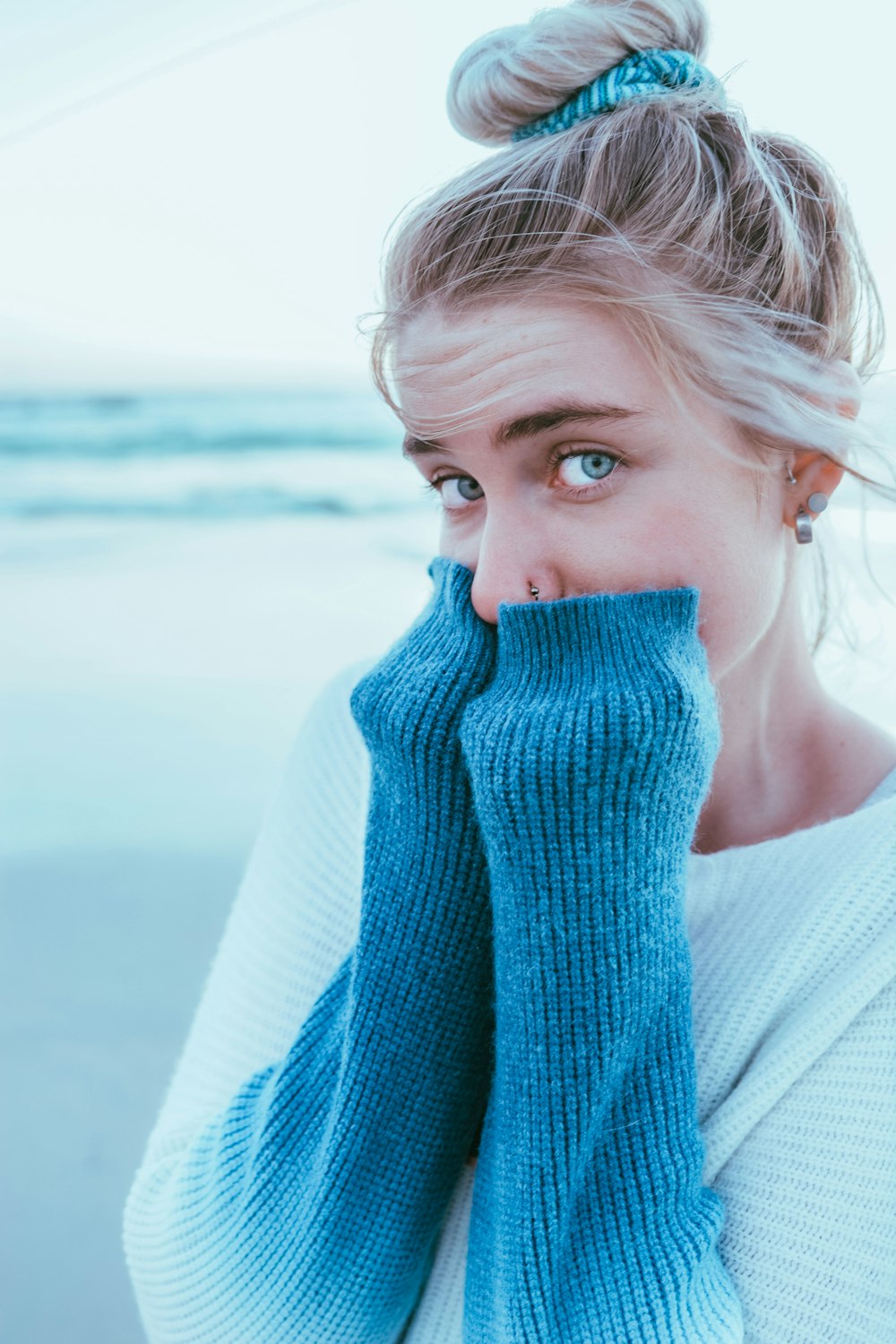 woman wearing white and blue long-sleeved shirt