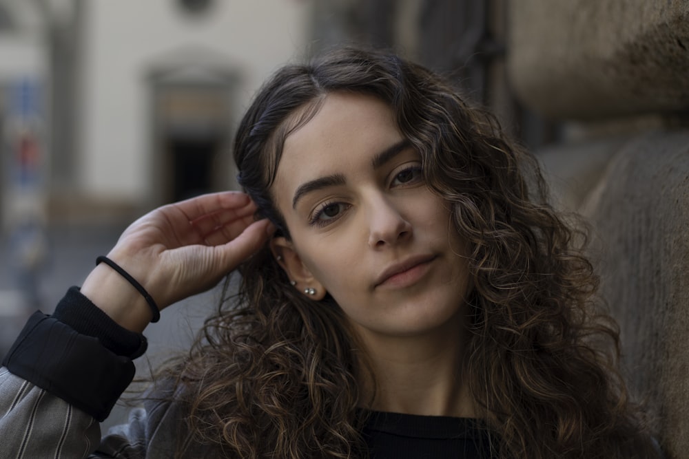 woman fixing hair