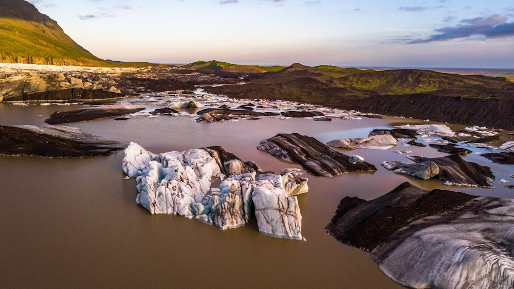 white and brown rock rocks at water