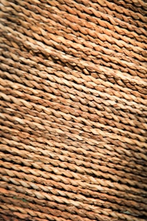 Close-up of a handwoven rug showcasing intricate texture and natural fibers.