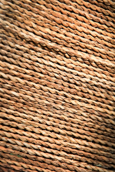 Close-up of a handwoven rug showcasing intricate texture and natural fibers.