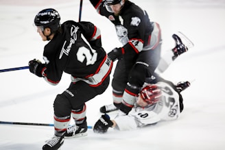 men playing ice hockey