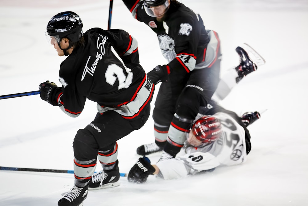 men playing ice hockey