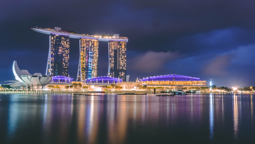 blue and brown concrete city buildings during night time