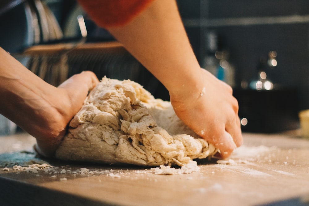 person mixing dough