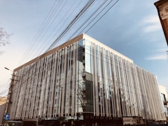 A modern commercial building with visible electrical installations.