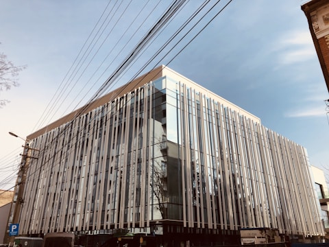 A modern commercial building with visible mechanical and electrical installations.