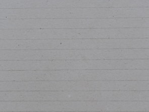 A textured paper with horizontal lines evenly spaced across the surface. The paper appears to be light gray with subtle specks and fibers visible.