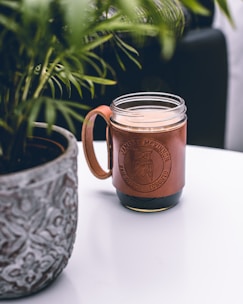 Leather-wrapped mate showing warm tones and personalized engraving.