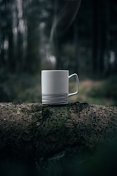 white ceramic mug on grey surface